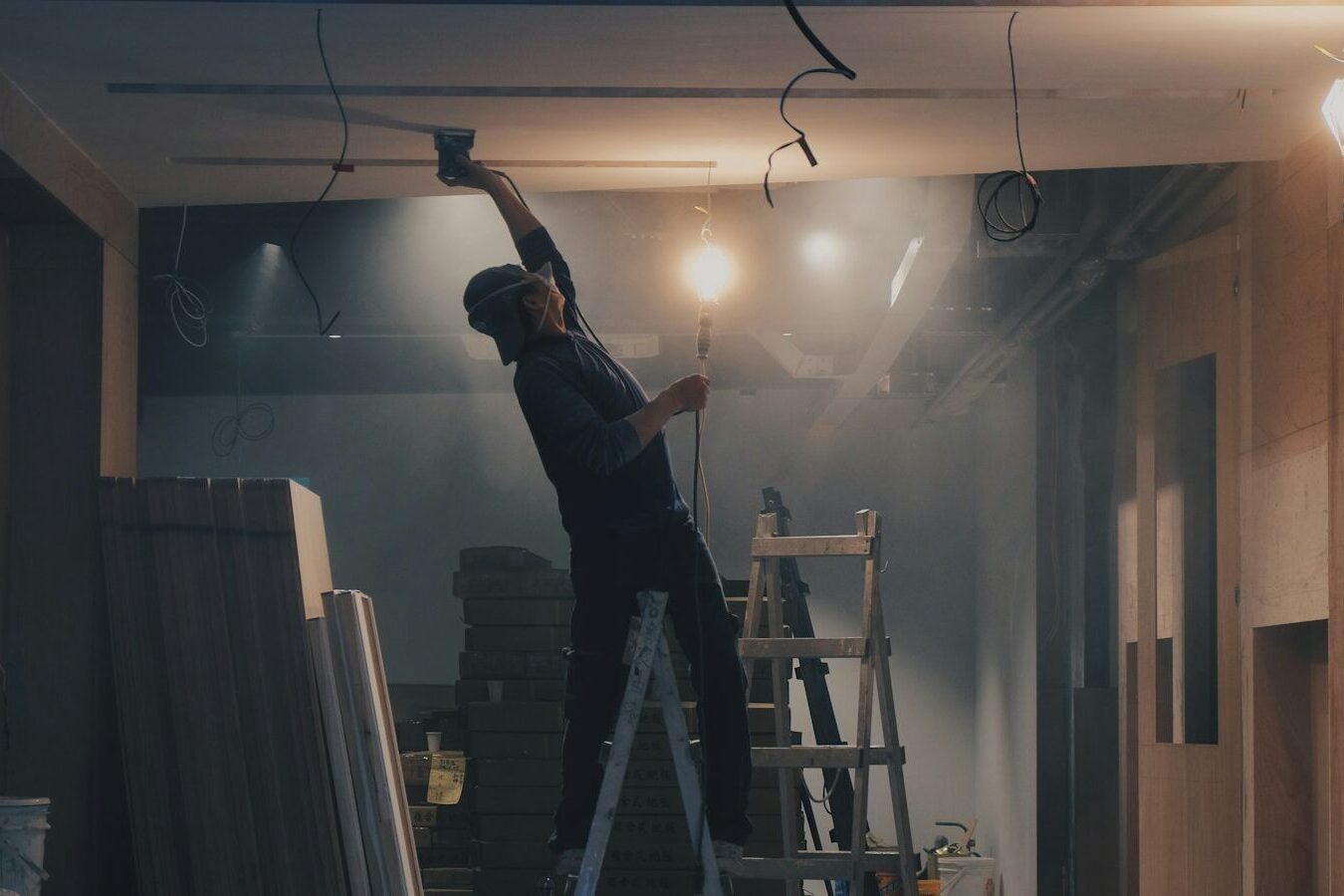 man on white ladder